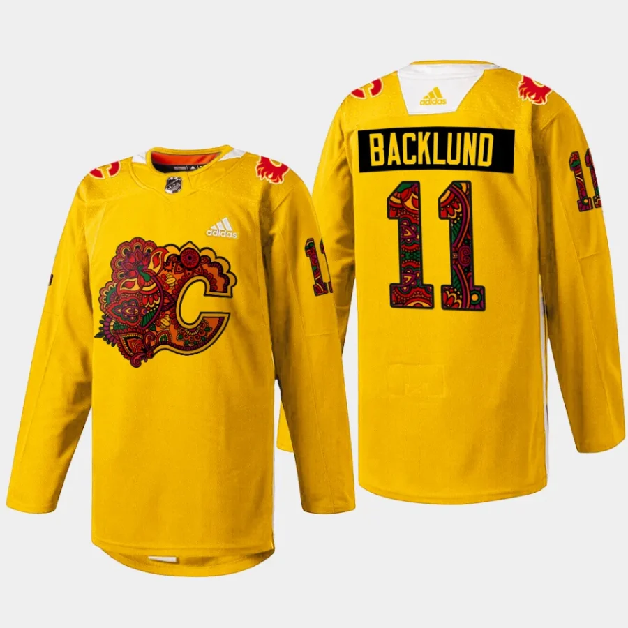 men flames mikael backlund holi south asian celebration 2024 gold jersey