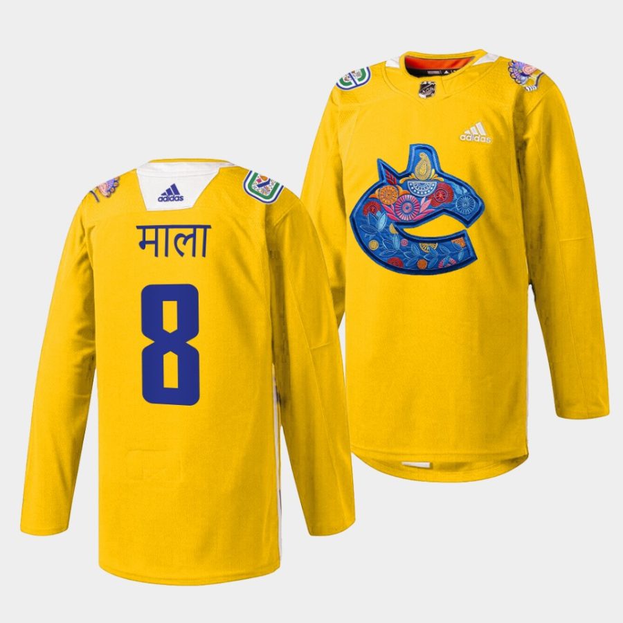 conor garland canucks warmup 2022diwali night yellow jersey